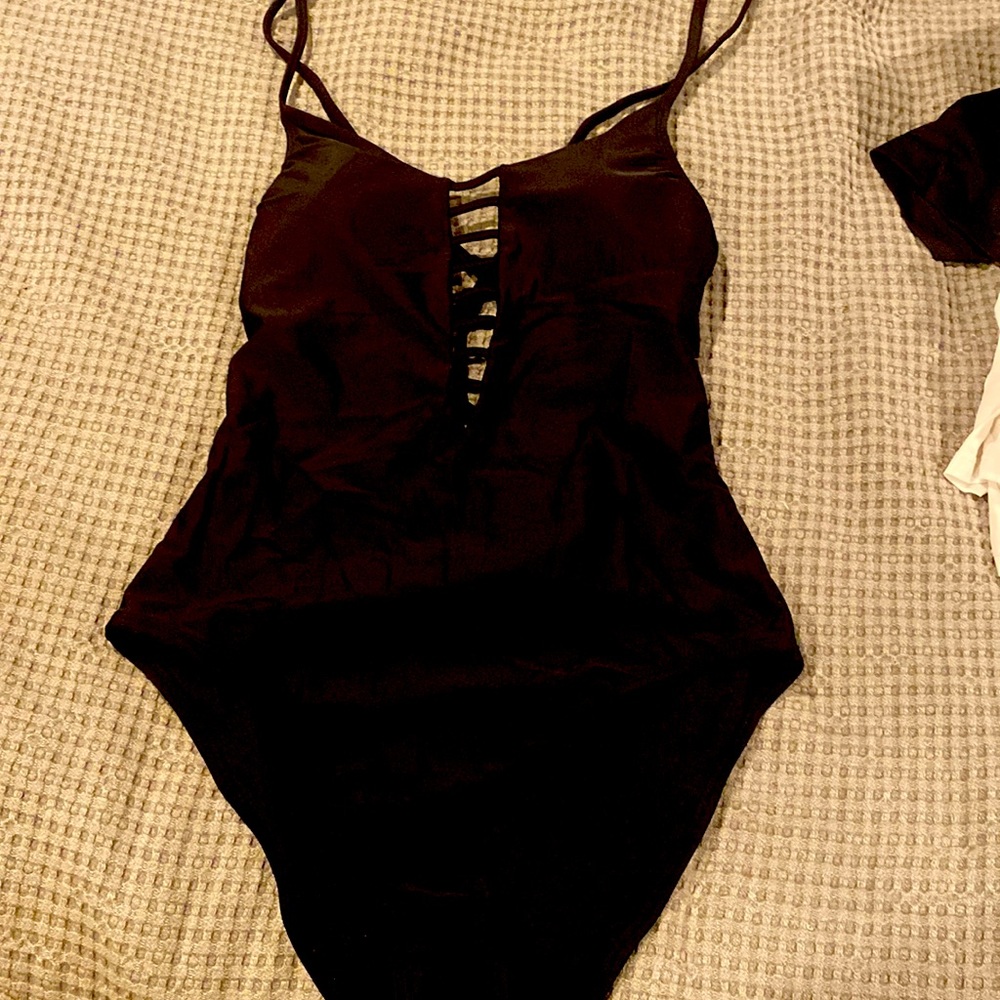 One piece black bathing suit.  High legged on bottom